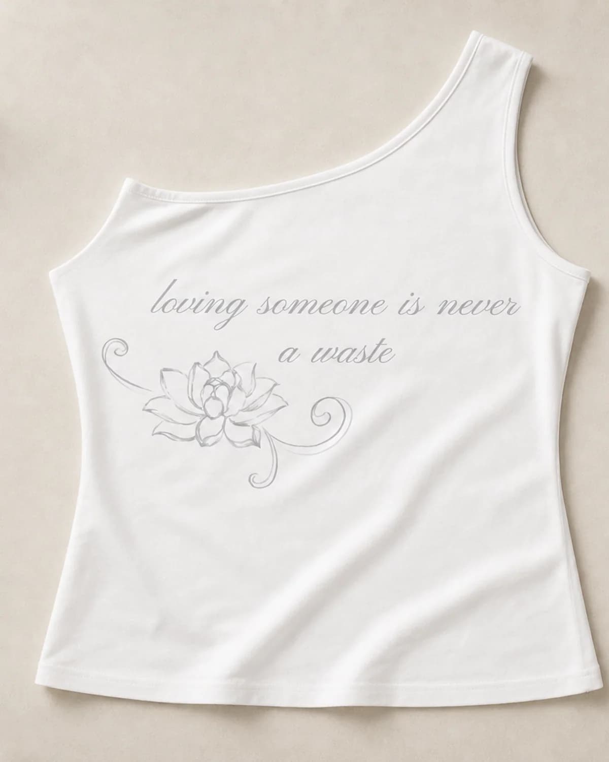 Flat lay of The Signature Graphic Top in white